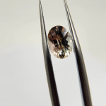 Cute .96ct Oregon Sunstone oval. Pink with champagne