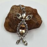 “Weird!” Oregon Sunstone Statement Pendant – 8ct Bicolor Center with 22 Surrounding Stones, 61mm Sterling Silver Design