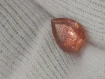 1.8ct Red/orange Oregon Sunstone with constellation shiller - Image 3