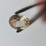 1.82ct Peach-Gold Oval Oregon Sunstone with Teal Highlights (9×7mm) — Brilliant Color, Perfect for Ring or Pendant